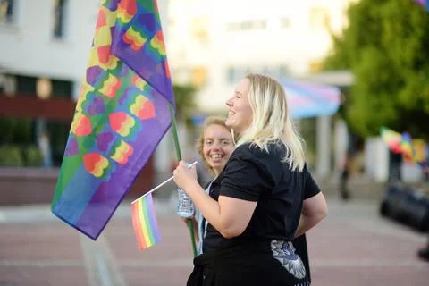 View of people column with rainbow flags Stock Photos