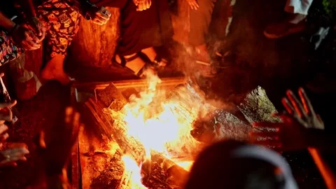 View of people gathered around a bonfire at night enjoying warmth and socia.. Stock Footage 336733503
