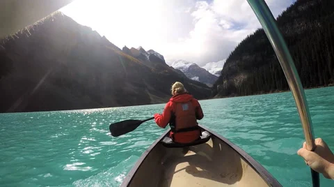 View of people Kayaking Lake Louise Alberta Canada Stock Footage
