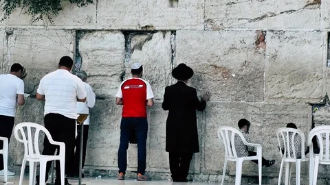 View of people praying front the wailing wall in Jerusalem Stock Footage 91164822