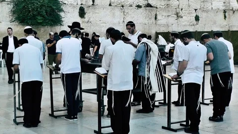 View of people praying front the wailing wall in Jerusalem Stock Footage 91198377