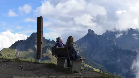 View of people sitting at Schynige Platte Switzerland Stock Footage 89934757