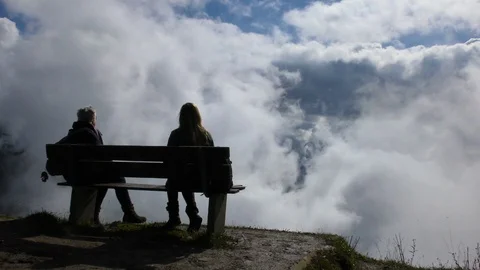 View of people sitting at Schynige Platte Switzerland Stock Footage 89937556