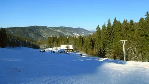 View on people skiing in the mountains activity snowboard vacation adventure Stock-Footage 105265944