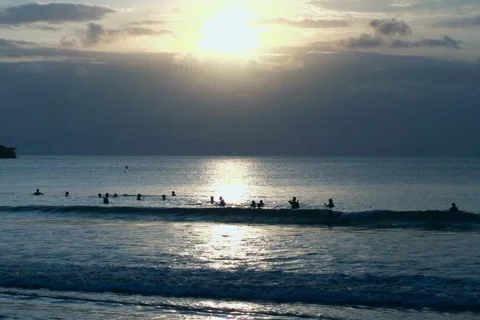 View of people swimming in the sea while sunsetting, slow motion shot at 240fps Vídeo Stock 41646428