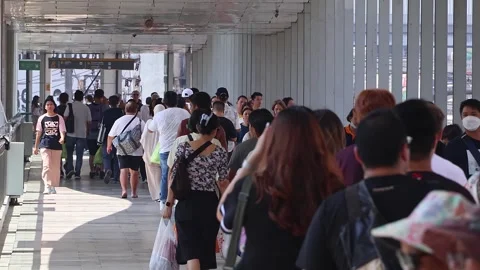 View of people using skywalk near Central World shopping mall. Stock Footage 284176016