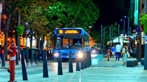 View on the people walking and the bus at night on Egyetem Square in Budapest, Stock Footage 121236291