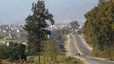 View of people walking on the road towards Surkhet city, Nepal. Video stock 335468065