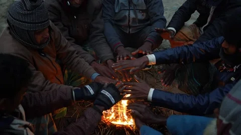 View of people warming hands by a fire in Bogura, Bangladesh. Stock Footage 335550829