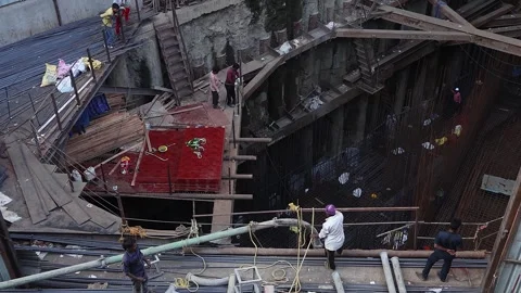 View of people working on a contruction site of a skyscraper. Stock Footage 277138562