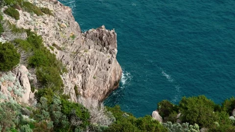 View of the perfectly clear sea from rugged cliffs. Stock Footage 304667248