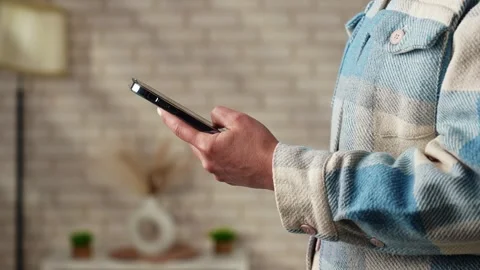 View of a Person Holding a Smartphone Device Stock Footage 309229504