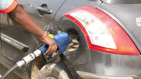 View of petrol pump worker filling petrol in car Video stock 147677570