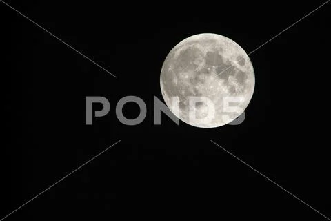 View, of a phase, of the lunar eclipse through a telephoto lens in Turin, Ita Stock Photos