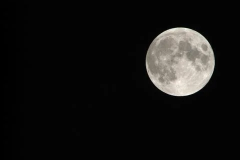 View, of a phase, of the lunar eclipse through a telephoto lens in Turin, Ita Stock Photos