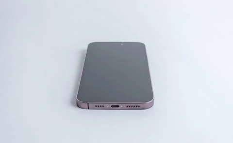 View of the phone on the table from the bottom. Charging port and the speaker Stock Photos