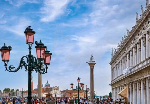 View of Piazzetta of St Mark's square, Venice, Italy, full of tourists, evening Stock Photos