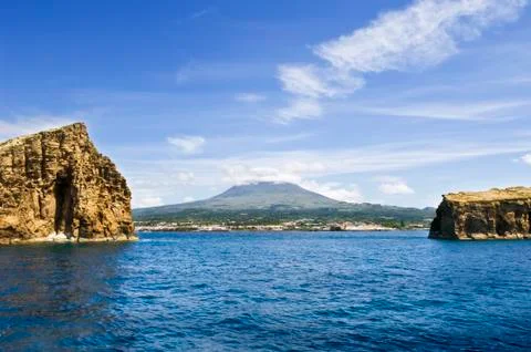 View of pico island with two islets in the foreground Stock Photos