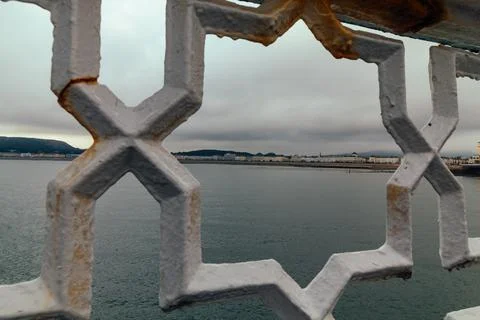 View from the pier between the railing, Llandudno in Wales United Kingdon Stock Photos