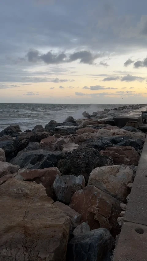 View from pier during storm in evening in Benalmadena. Vertical video Stock Footage 240921712