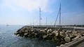 View from pier of small sailing boat floating in open sea, summer rest, sequence HD Footage