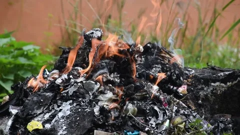A view of a pile of garbage burning with fire Stock Footage 238740908