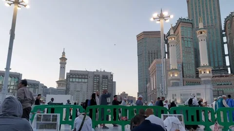 View of pilgrims circling the Kaaba on the rooftop of the Masjidil Haram Stock Footage 309892641