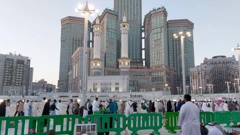 View of pilgrims circling the Kaaba on the rooftop of the Masjidil Haram Stock Footage 309892811