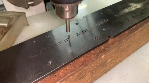 View of pin punch for insertion into mould plate machine Stock Footage 296629931