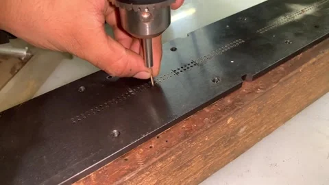 View of pin punch for insertion into mould plate machine Stock Footage 304573931