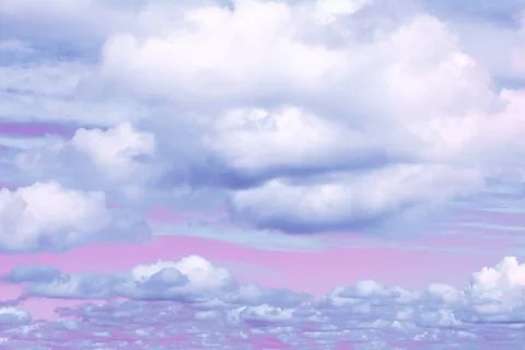 View of the pink sky with cumulus clouds. Concept art, landscape, background. Stock Photos