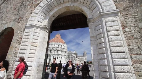 View of  Pisa and "Piazza dei Miracoli" from Stone door in city walls, Tuscan Stock Footage 76163235