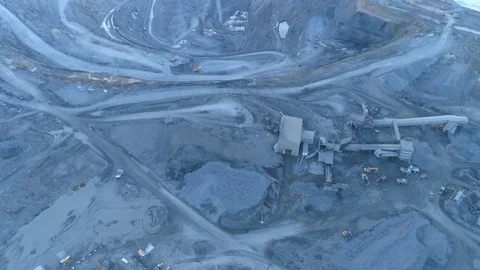 View of a pit on extraction of ore, work of trucks and an ekskvator Video stock 96487099