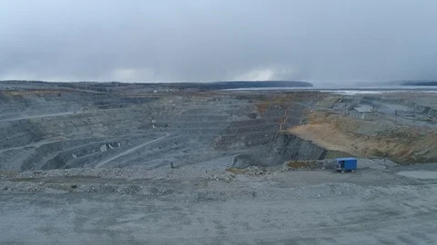 View of a pit on extraction of ore, work of trucks and an ekskvator Video stock 96565068