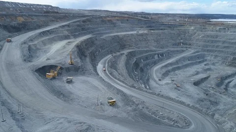 View of a pit on extraction of ore, work of trucks and an ekskvator Video stock 96566343