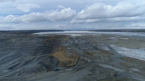 View of a pit on extraction of ore, work of trucks and an ekskvator Video stock 96566804