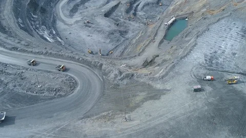 View of a pit on extraction of ore, work of trucks and an ekskvator Video stock 96566990