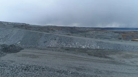 View of a pit on extraction of ore, work of trucks and an ekskvator Video stock 96567243