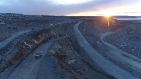 View of a pit on extraction of ore, work of trucks and an ekskvator Stock Footage