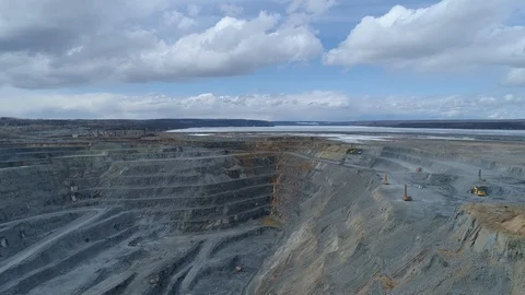 View of a pit on extraction of ore, work of trucks and an ekskvator Video stock 96567515