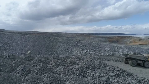 View of a pit on extraction of ore, work of trucks and an ekskvator Video stock 96567726