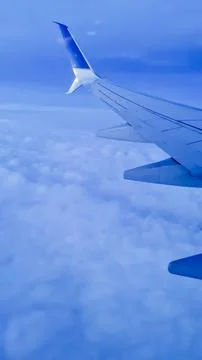 View from the plane above the clouds. Stock Photos
