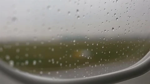 View from the plane on the apron through the window with rain drops Video stock 72193946