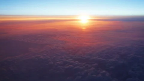 The view from the plane on the clouds and the rising sun 스톡 동영상 98466364