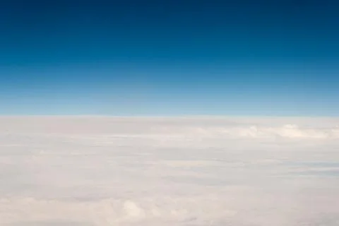 View from off the plane on clouds Stock Photos