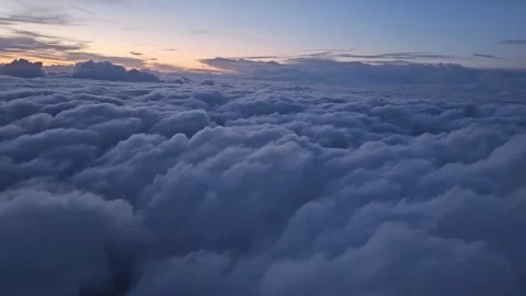 A view from the plane of endless blue clouds stretching into the distance Stock Footage 343943209