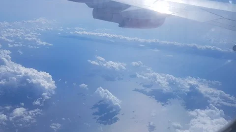 The view from the plane on the floating clouds the sea and islands Stock Footage 126270070