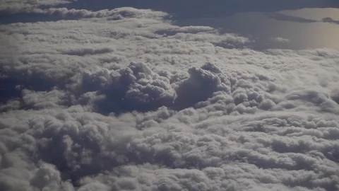 View from plane flying above the clouds in sunny day  Video stock 87906674