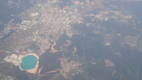 View from the plane flying over the lake in the middle of the island Stock Footage 130168455