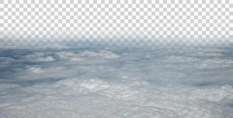 View from a plane looking down on a cloudy sky with the upper portion of the Stock Photos